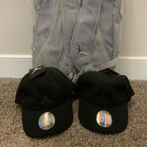 Air Jordan Jumpman Backpack with two Air Jordan Adjustable Baseball Hats.